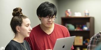 Students working on a laptop